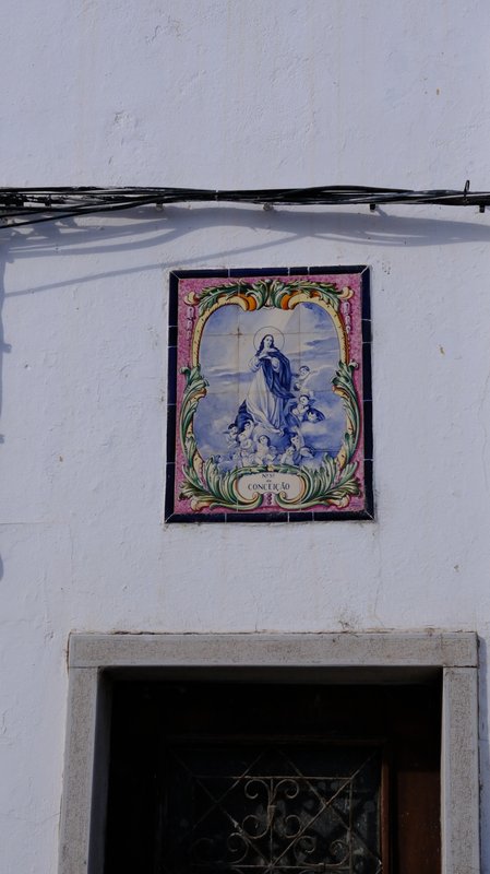 Azulejo saint above a doorway
